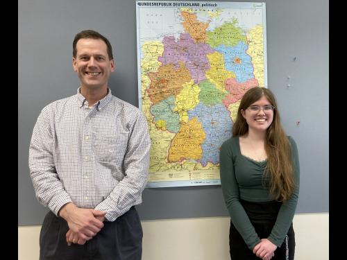 Patrick Schultz of the Modern Languages and Literatures Department congratulates SUNY Oswego student Marie Parker on receiving a German Academic Exchange Service (Deutscher Akademischer Austauschdienst, or DAAD) grant to study this summer in Germany.