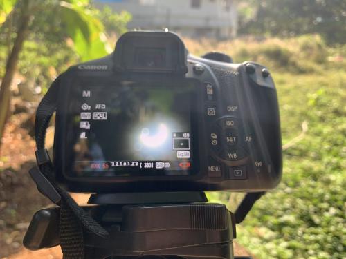 View of a solar eclipse through a viewfinder -- courtesy of Delse Pauly DM under a Creative Commons license