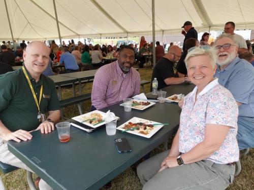 Administrators from SUNY Oswego enjoy the Campus Appreciation Barbeque