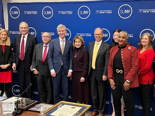 Interim SUNY Chancellor Deborah F. Stanley is surrounded by SUNY Board of Trustees after she was honored and appointed President Emeritus of SUNY Oswego at the Trustees Dec. 13, 2022 meeting in Albany.