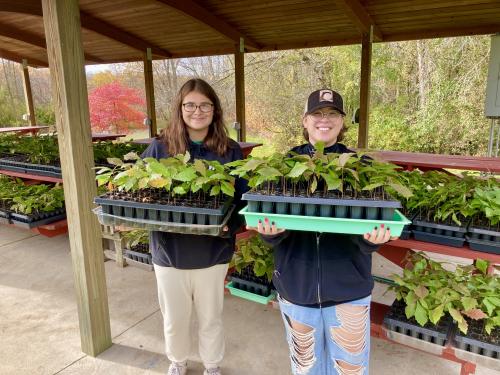 Students giving away trees at Rice Creek Field Station