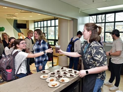 Customers line up at Rich and Pour Café in Rich Hall