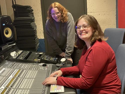 Oswego broadcasting students Samantha Kearney (left) and Jaime Hunter (right) pose for a photo in the recording studio in Lanigan Hall.