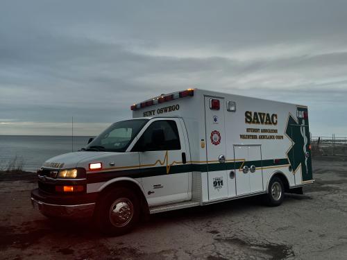 Photo of SAVAC ambulance on lakeshore at sunset