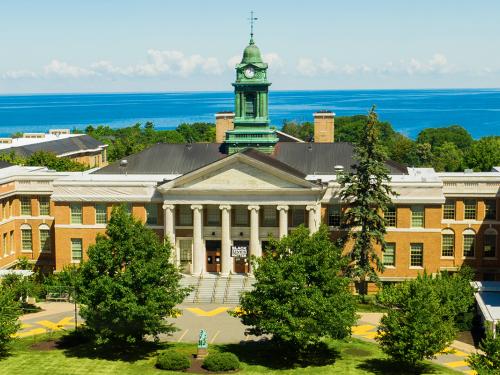 SUNY Oswego's historic Sheldon Hall on the shores of Lake Ontario