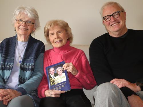 Kathy Fenlon and Jeff Rea present Barbara Shineman with a copy of The Shineman Legacy book