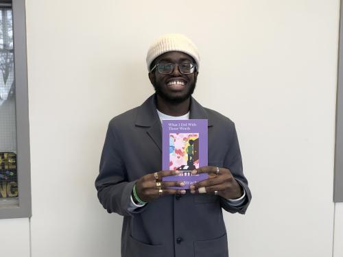 Student poet Rickey Strachan shows off his latest book of poetry, What I Did With These Words