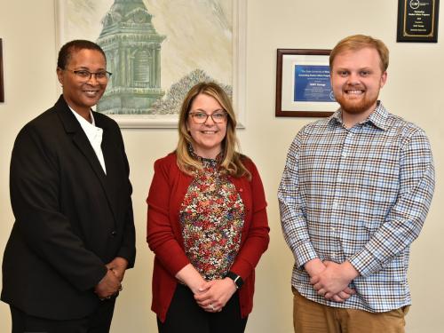 Three student affairs professionals gather in recognition of statewide awards