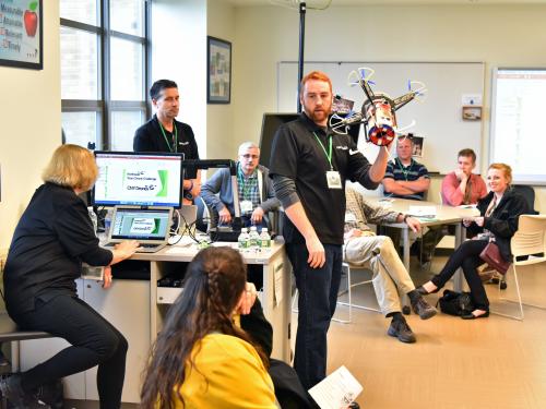 A presenter shares a creation with a previous Fall Technology Conference audience