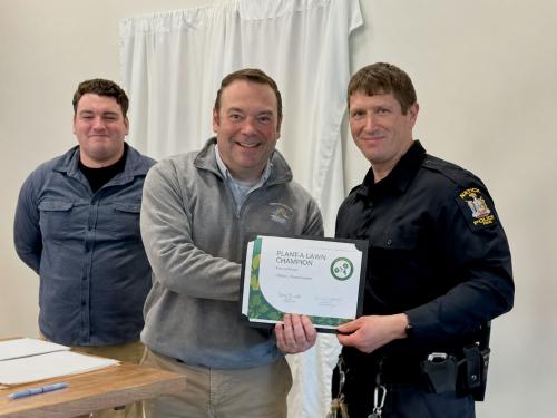 University Police Officer Jacob Lyon (right) receives the 2026 Traffic Safety Champion award from the Oswego County Traffic Safety Council via University Police Chief Scott Swayze (center) and Gavin Wandersee, Oswego County coordinator of traffic safety