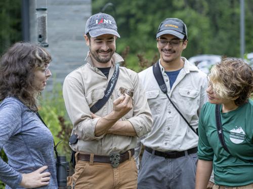 Biological sciences faculty member Daniel Baldassarre and his research students at Rice Creek observing birds