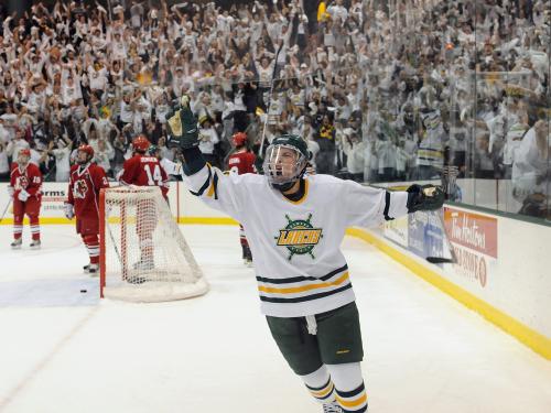 Laker hockey player celebrates along with Oswego fans