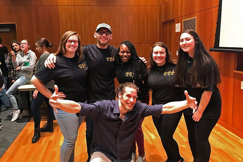 American Sign Language storyteller Dack Virnig with ASL Club officers