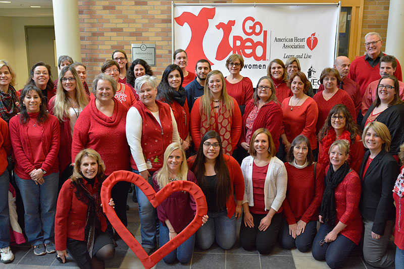 Staff posing in red