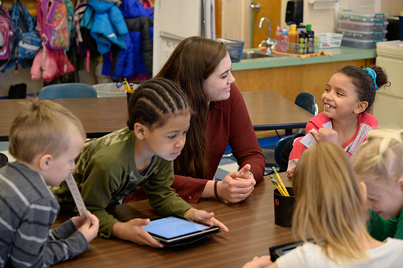 Teacher at Leighton with students