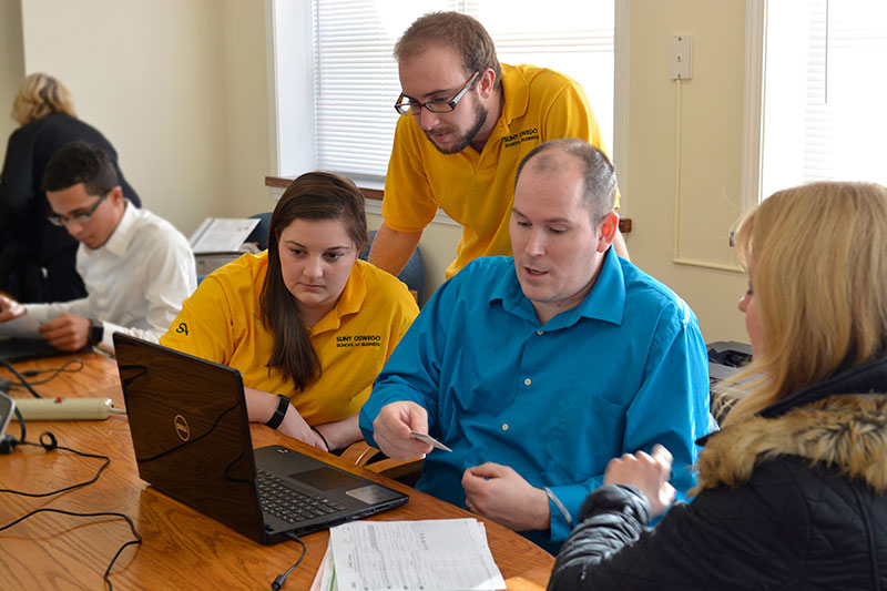 Students preparing tax returns for clients