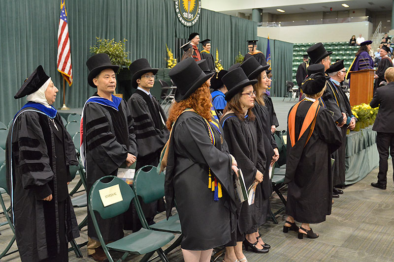 Faculty and platform party in top hats