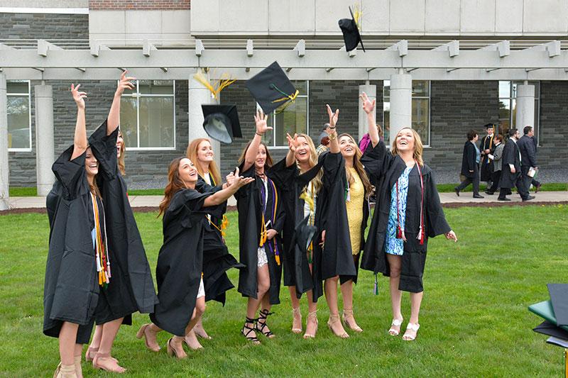 Students throwing caps