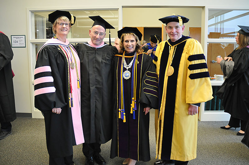 Commencement speaker Richard Einhorn with Oswego leadership