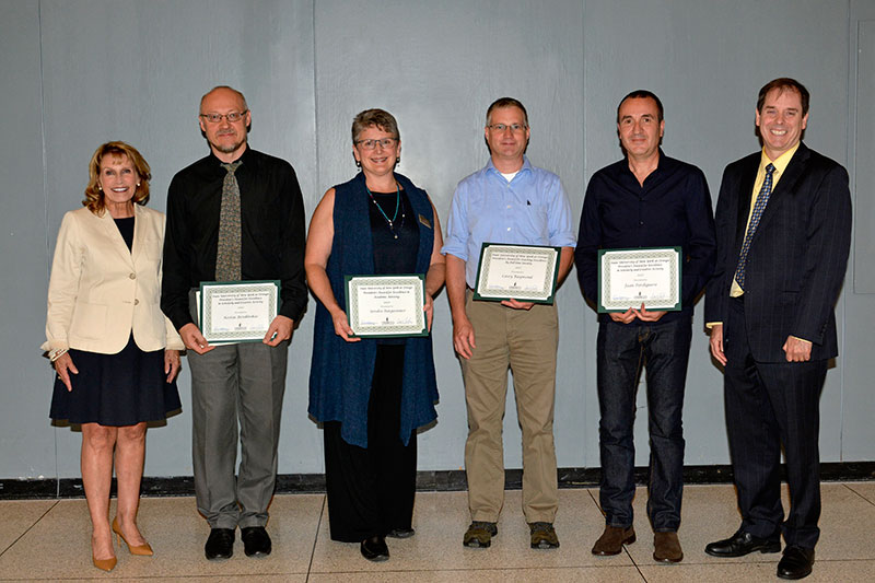 President Stanley with faculty award winners