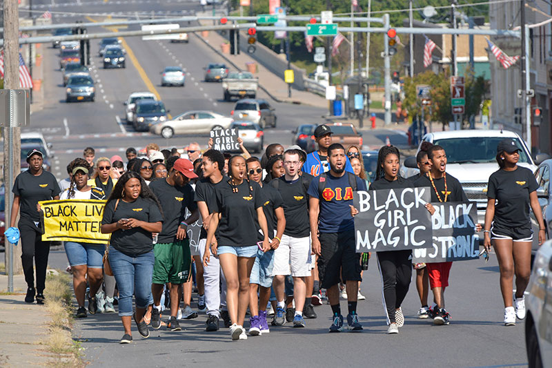 Students, administrators walk down Bridge Street for ALANA Unity Peace Walk