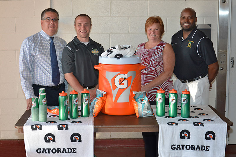 College and Pepsi representatives with Gatorade donation