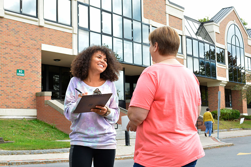 MacKenzie Grow collects data at MacKenzie Grow (left), a gender and women's studies major, collects data at the Oswego County Department of Social Services