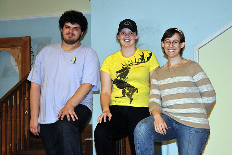 Student crew of Clybourne Park poses on stage