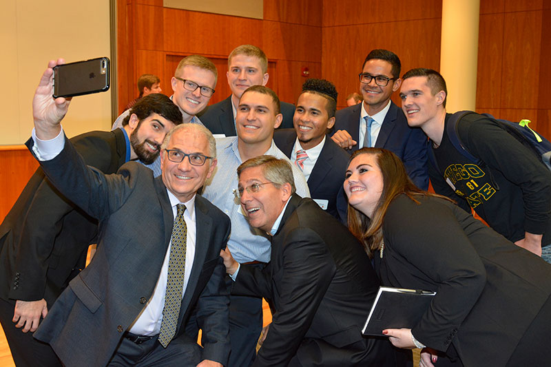 Bob Moritz poses with interns, recent hires