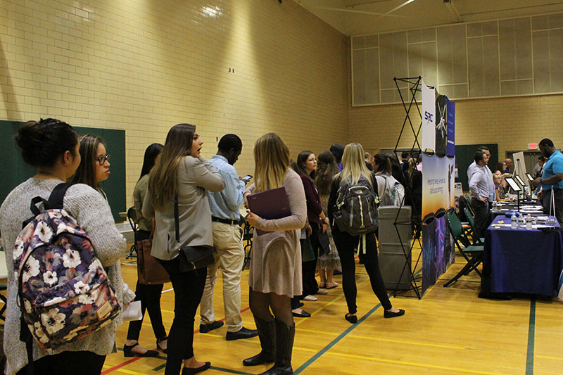 Students line up as the Fall Career Fair offers students a quick professional photo sesssion to add to their LinkedIn