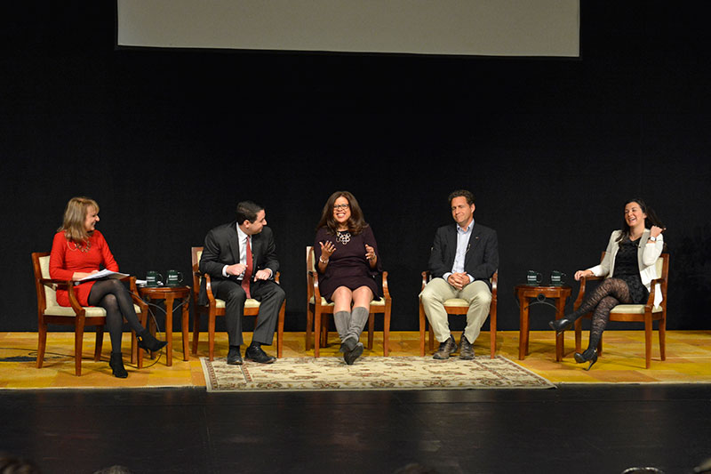 Media summit panelists share a laugh on stage