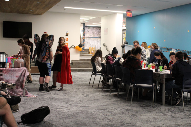 Students in costume participate in Halloween party