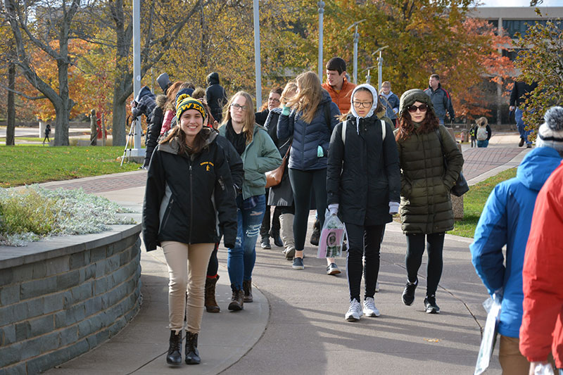 Krystal Cole leads a campus tour