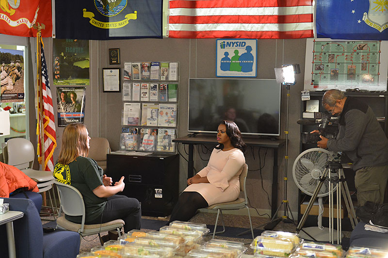 TV reporter interviews student veteran