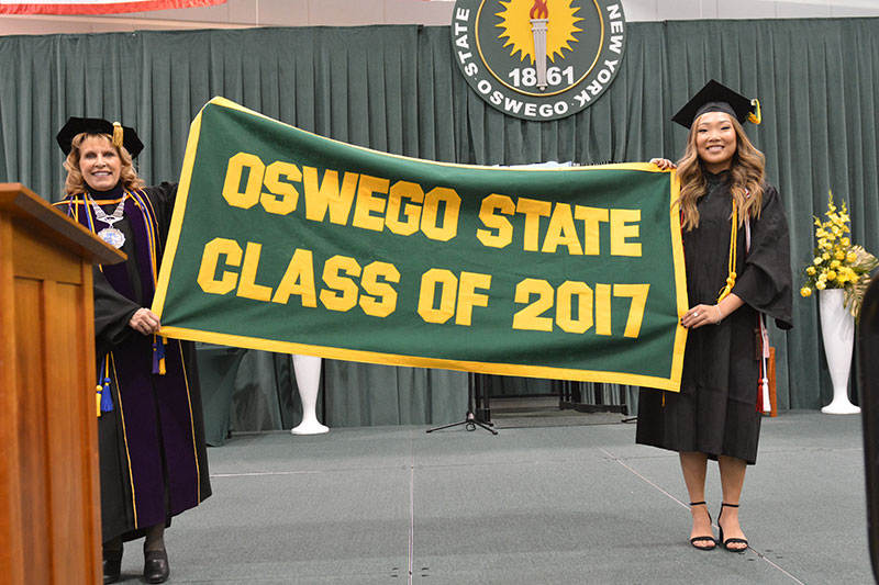 President Stanley and student hold Class of 2017 banner