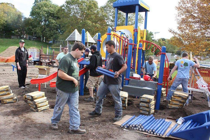 Students, community members build playground