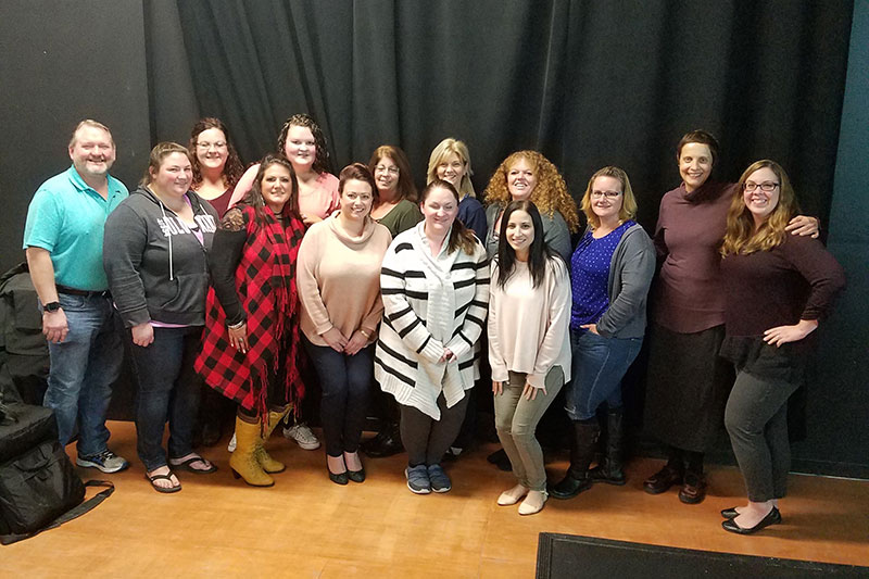 Group of educators pose during a break in Circle of Security Parenting training session