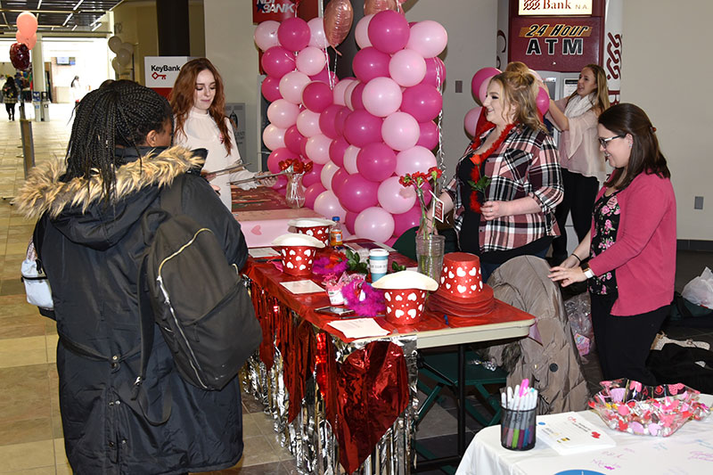 Volunteers greet students at Love a Donor Day event