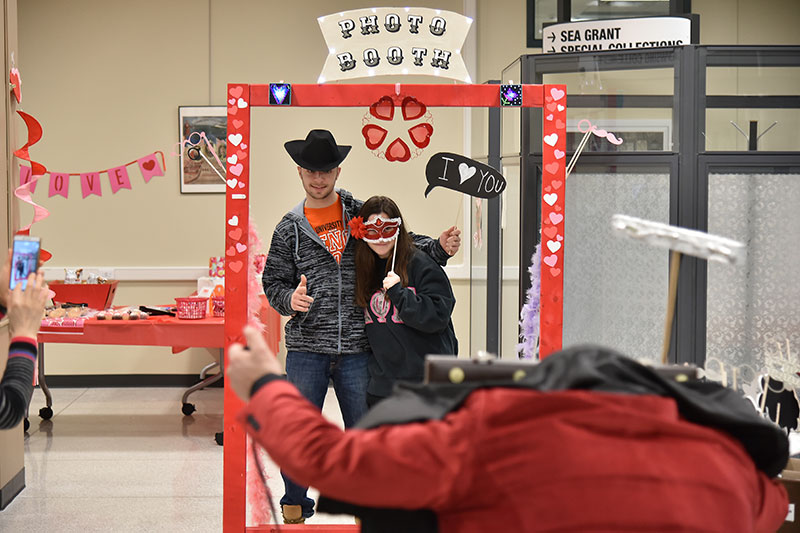 Students pose in photo booth