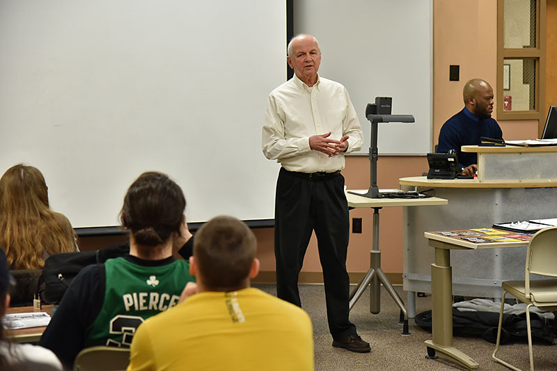 Alumnus William Stata, owner of Stata Marketing, speaks to business class