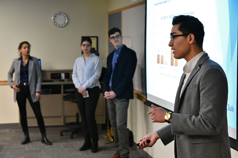 SUNY Oswego Investment Club members discuss stock selection