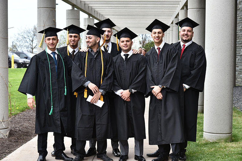 School of Business graduates pause for a group photo before Commencement