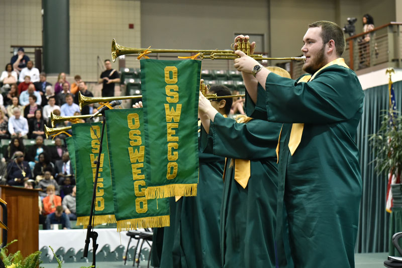 Trumpeters signal the start of the 1 p.m. School of Business ceremony