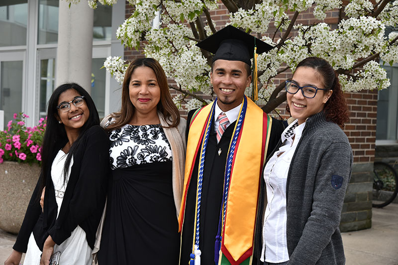 Accounting graduate Yan Carlos Minaya celebrates with loved ones