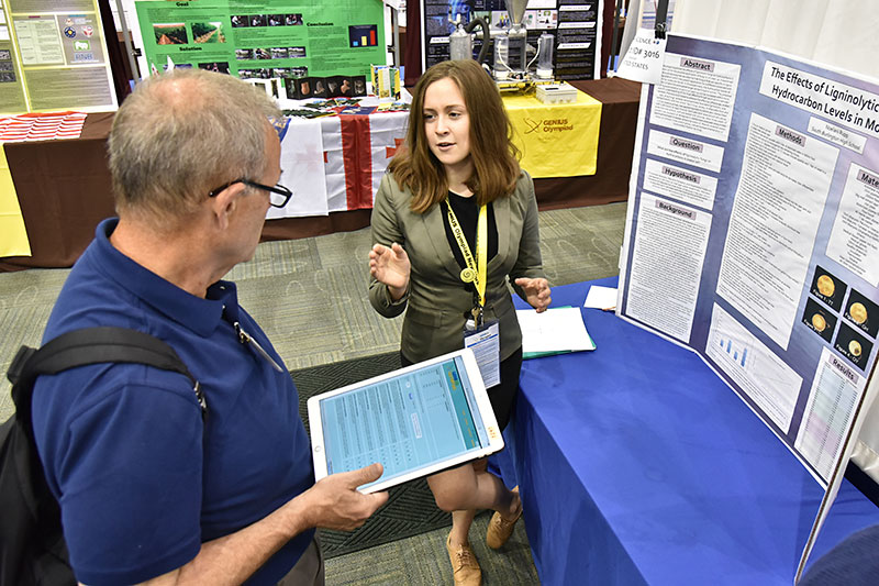 Noelani Rupp explains research at GENIUS Olympiad