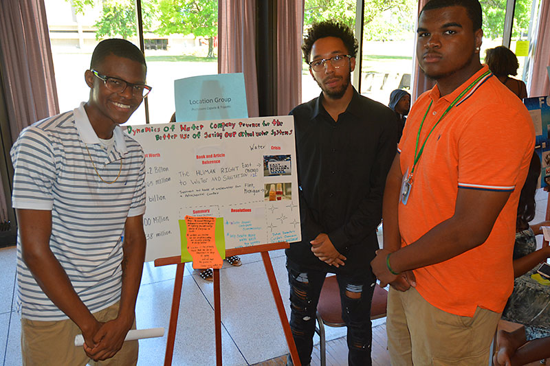 EOP students with conservation poster