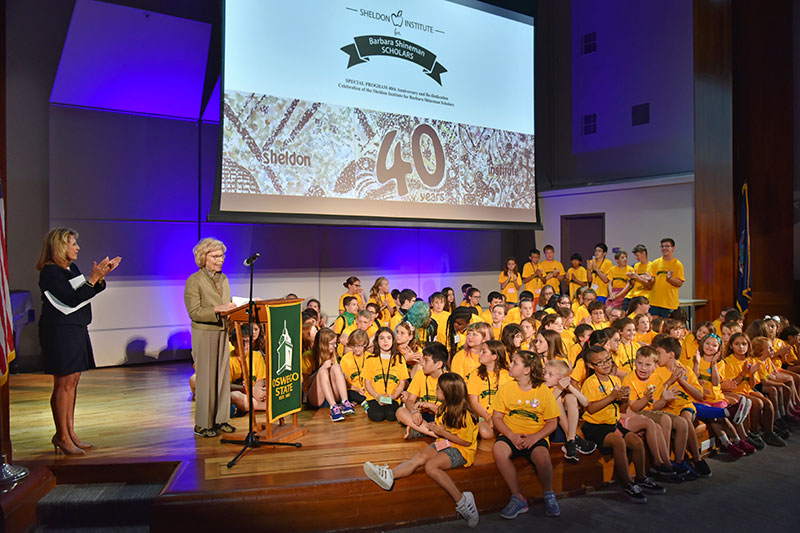 President Stanley, Barbara Shineman and student celebrate at Sheldon Showcase