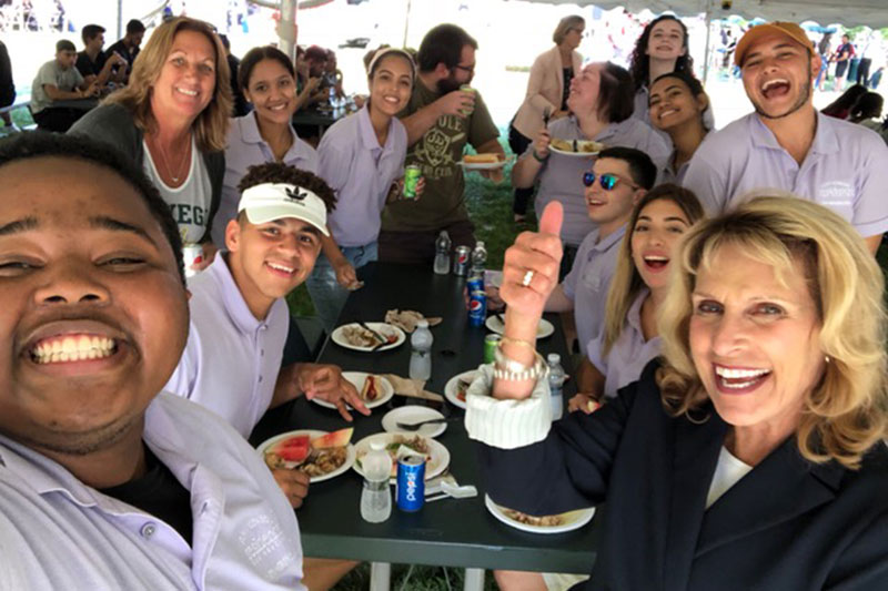 Students take a photo with President Stanley at the Welcome Picnic