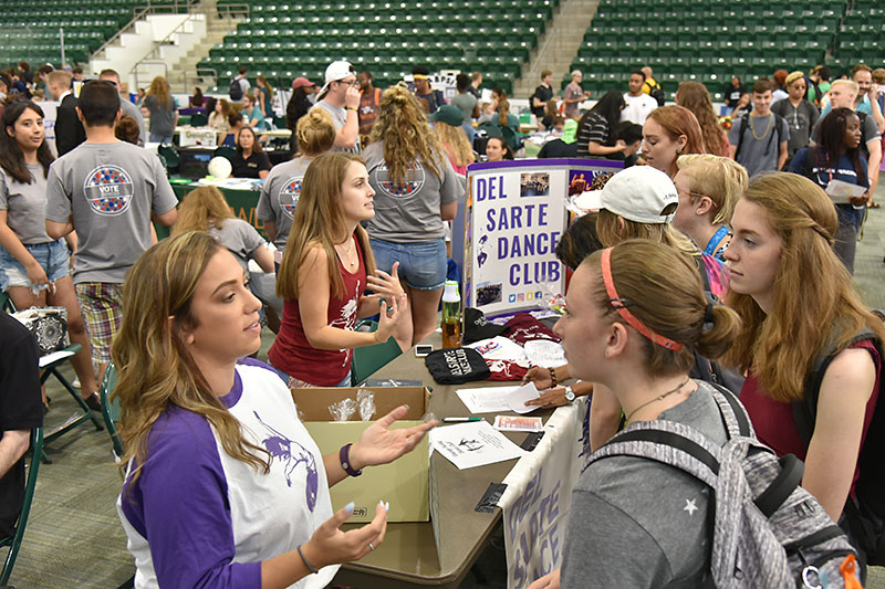 Students speak to Del Sarte Dance Club representatives at Student Involvement Fair