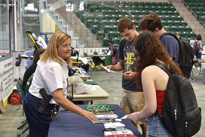 New University Police community relations officer Kelly Thompson speaks with students